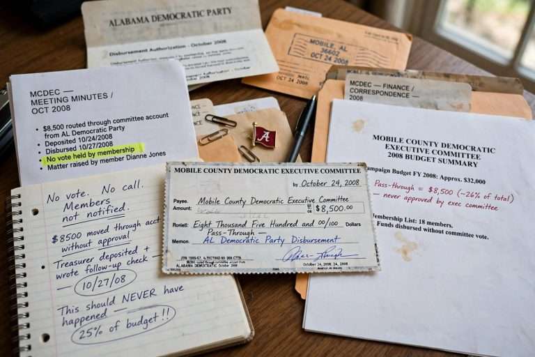 Illustration for the news story: An $8,500 Check Nobody Voted On: Mobile County Democrats Demand Answers on a ‘Pass-Through’ Donation