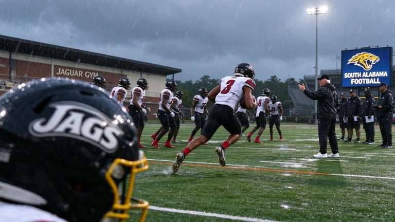 Illustration for the news story: South Alabama Football Practices Outdoors Between Rain Bands as UTSA Opener Moves to Saturday