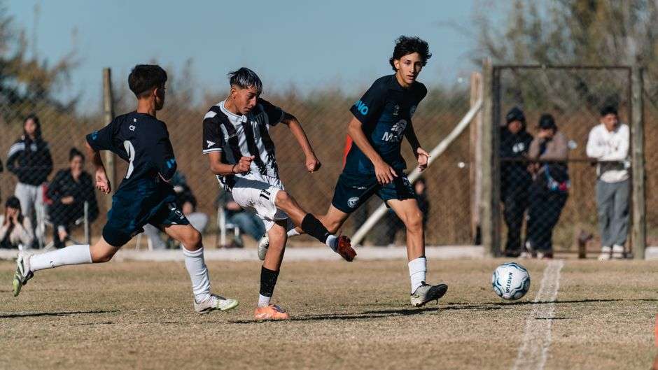 High school soccer players compete during a playoff match