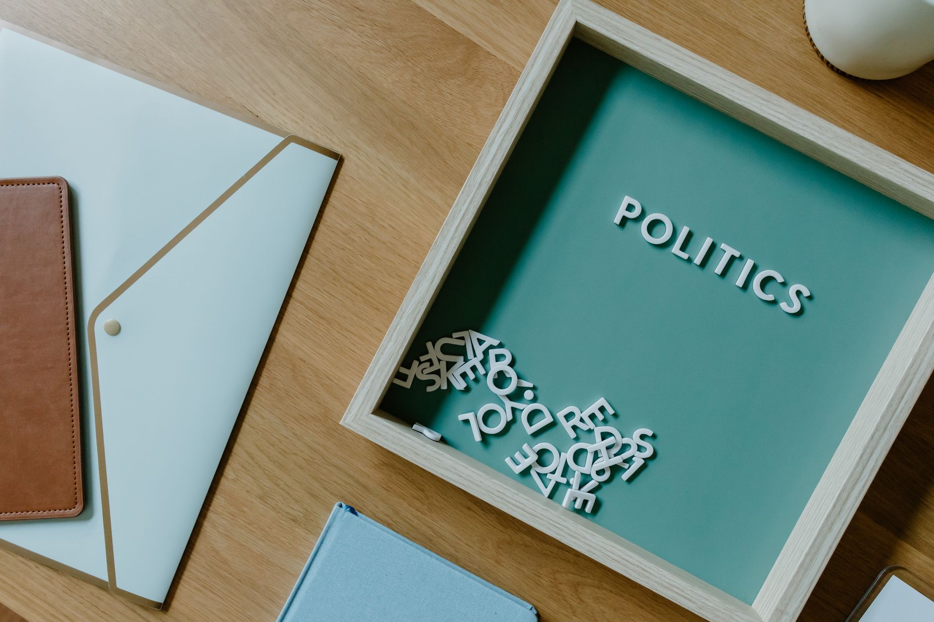 A desk with paperwork and a calendar marking a fundraising deadline