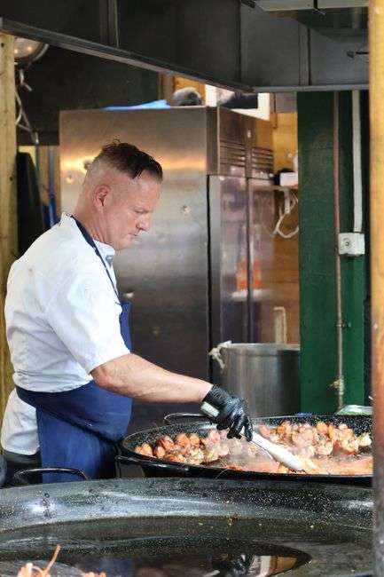 A chef preparing a fresh seafood dish for a cooking competition