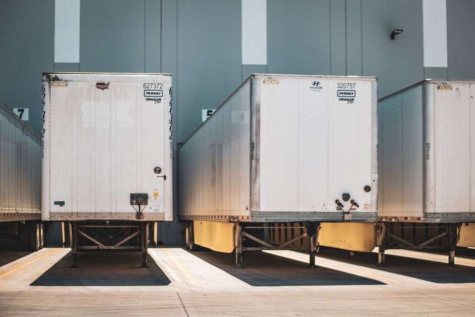 Freight trailers lined up at a logistics loading dock