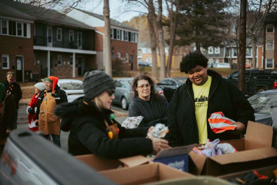 Wrapped holiday gifts and donated items set out for children and families during a community charity event