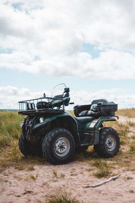 An all-terrain vehicle parked outdoors, representative of off-road recreational riding