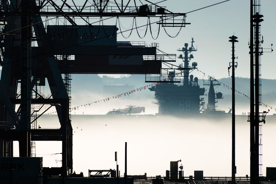 Navy combat ship docked at a shipyard