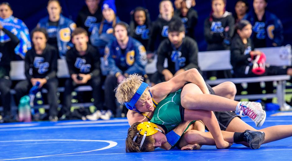 Student athletes competing in a high school wrestling match