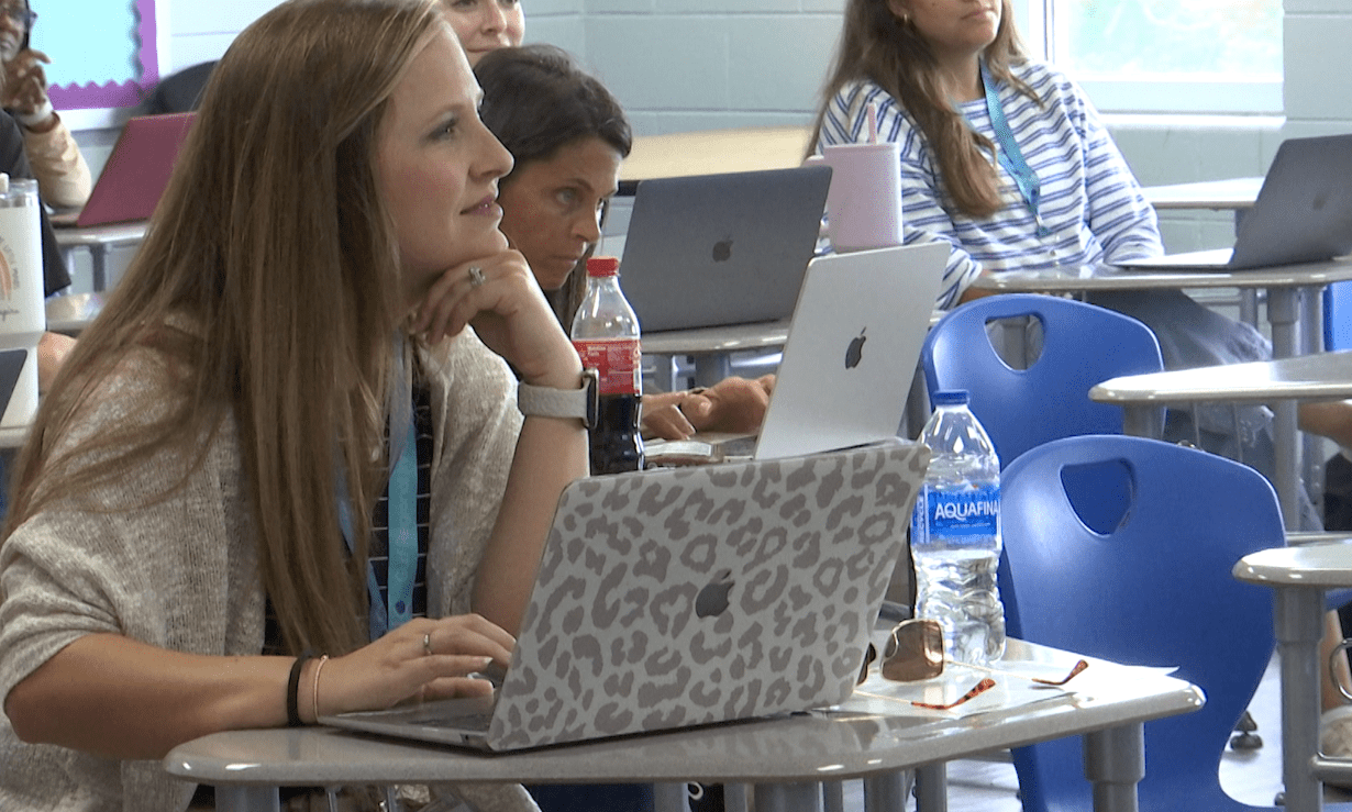 Teachers attending a professional development conference session