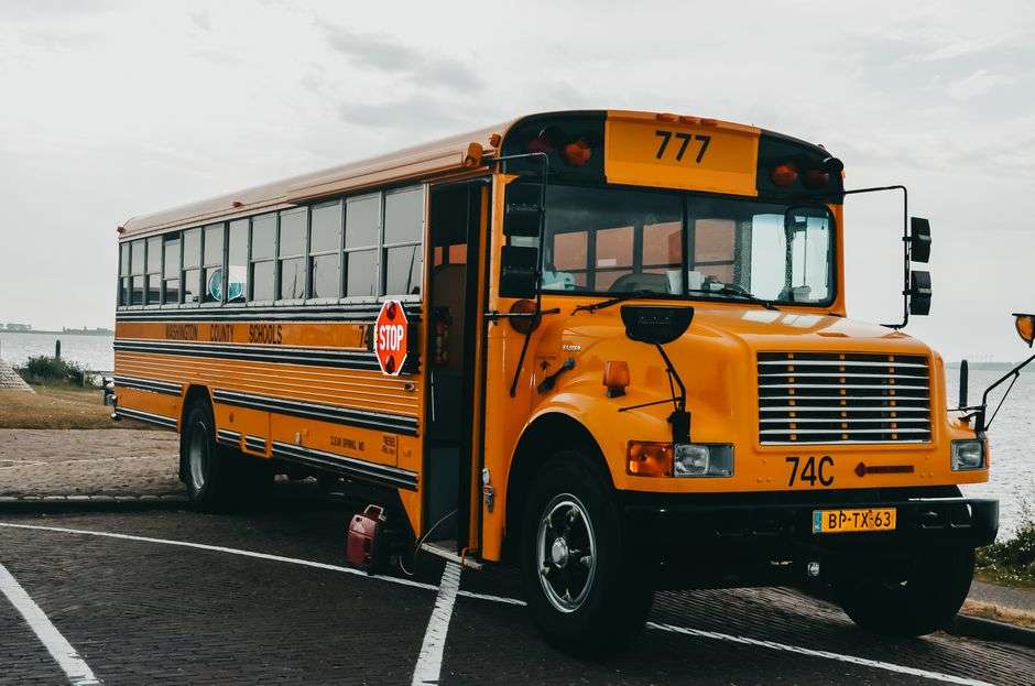 A yellow school bus preparing to transport students on a Baldwin County route