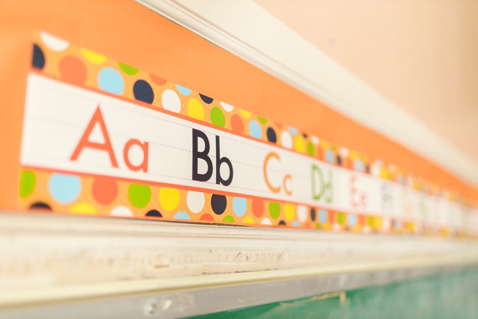 A brightly decorated elementary school classroom ready for students