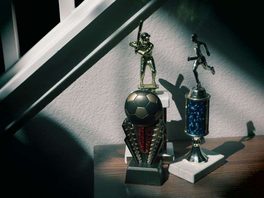 Baseball trophies and memorabilia displayed in a high school tradition room