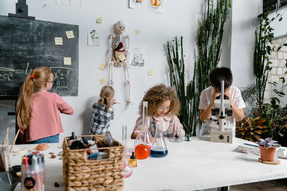 Children conducting a hands-on science experiment in a lab