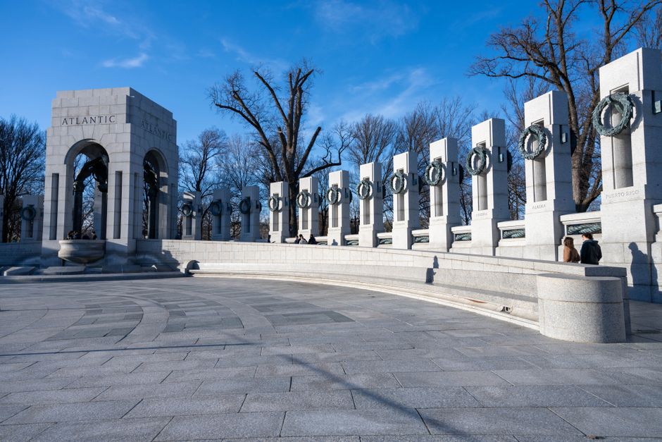 An elderly veteran visits the World War II memorial during an honor flight trip