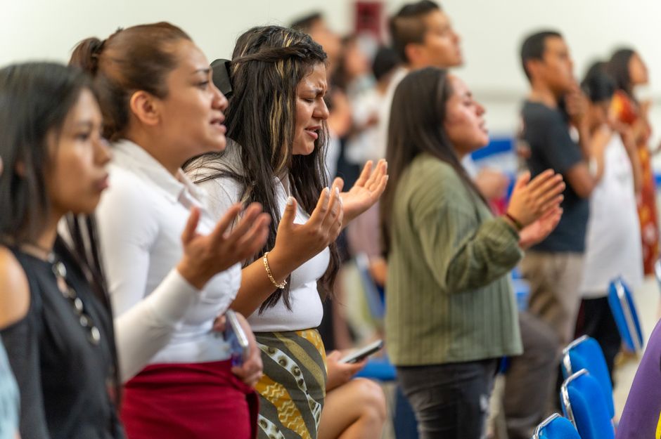 Attendees gathered at a community prayer breakfast event
