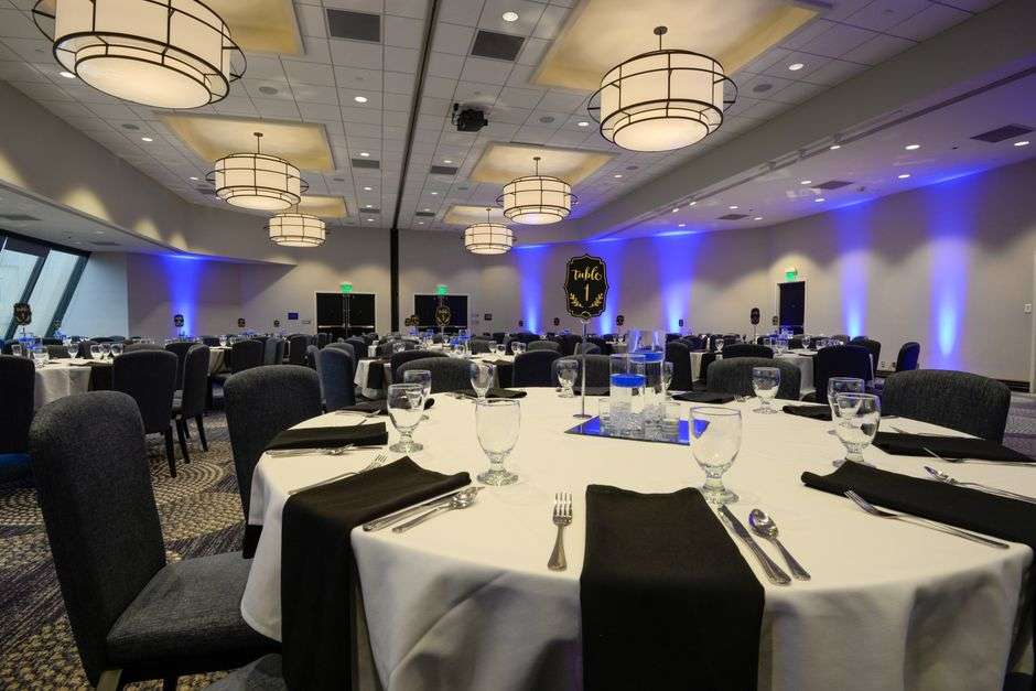 Banquet hall set with round tables for a charity fundraiser dinner