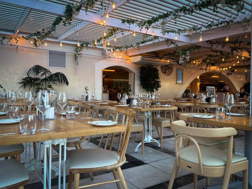 Bright, newly added dining room with tables and natural light at a local cafe