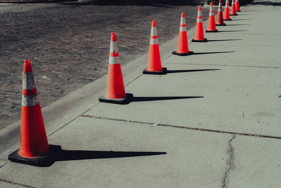 Traffic cones and roadwork on an urban street