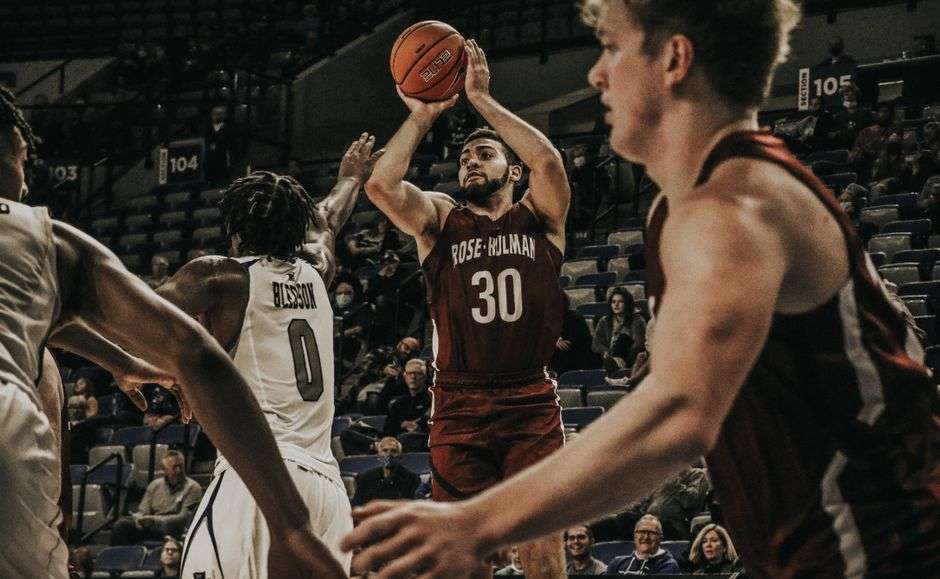 College basketball players competing during a game