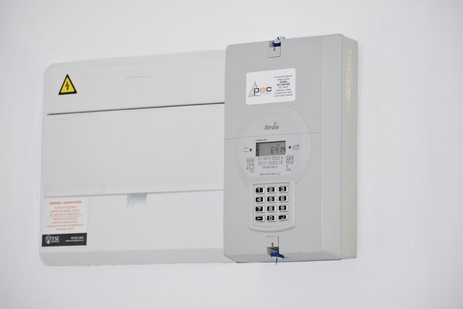 A utility bill and thermostat representing energy assistance in South Alabama