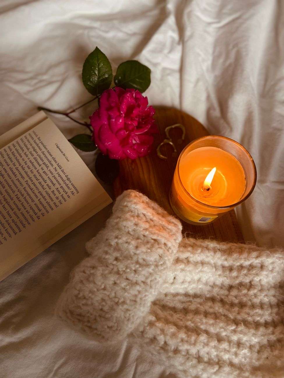 A single lit candle in soft light