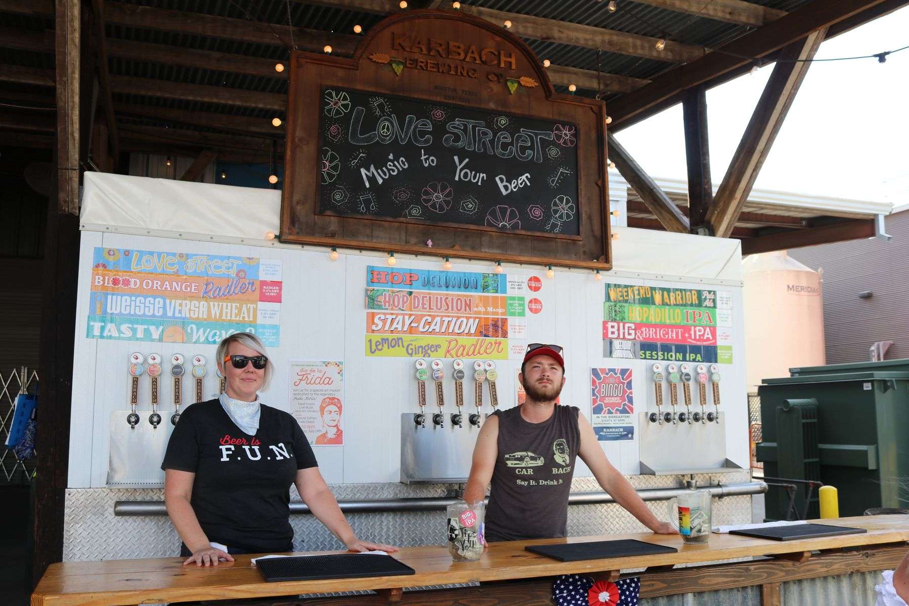 Glasses of craft beer being poured at an outdoor festival