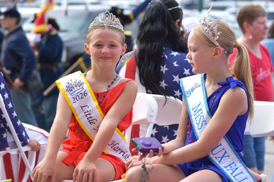 A pageant crown and trophy displayed together