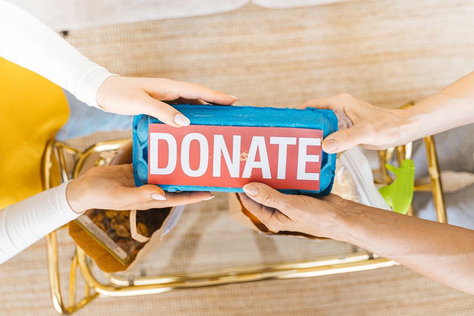 Red kettle donation stand used for holiday charity collections