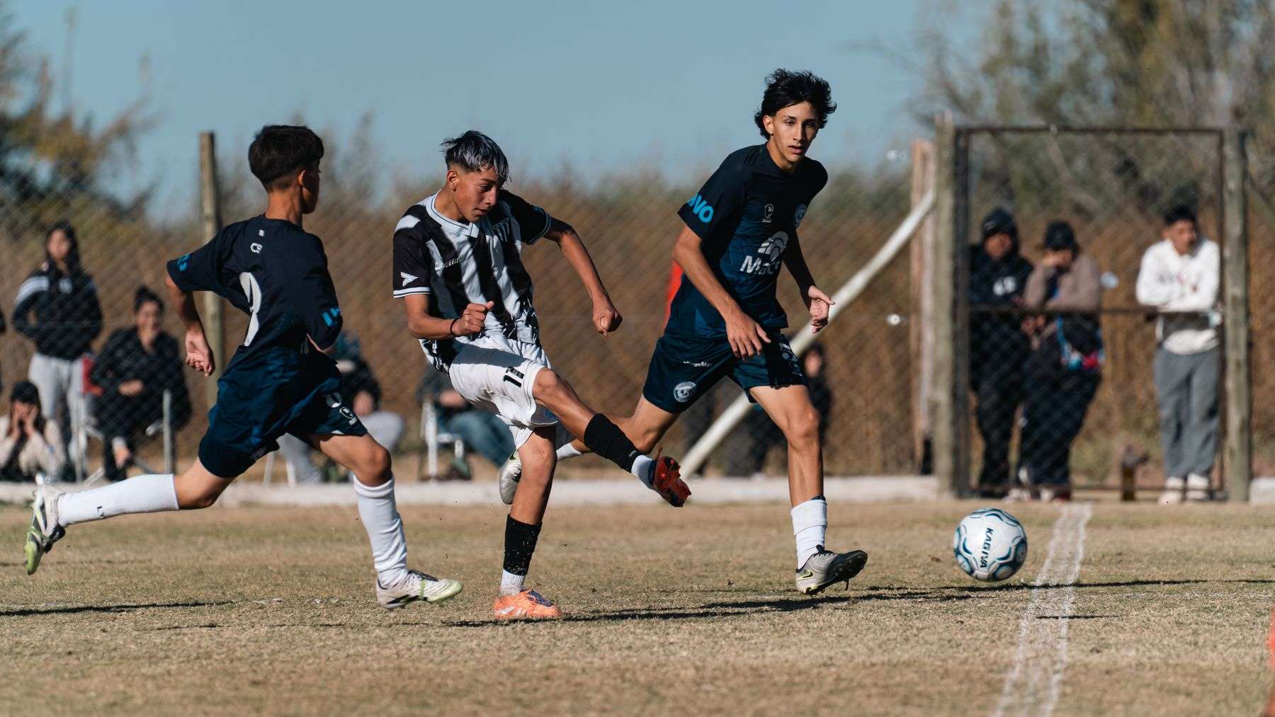 High school soccer players competing during a match