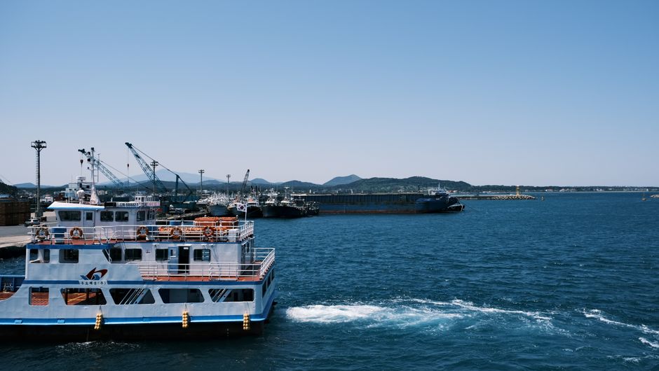 Ferry boat docked at a coastal terminal