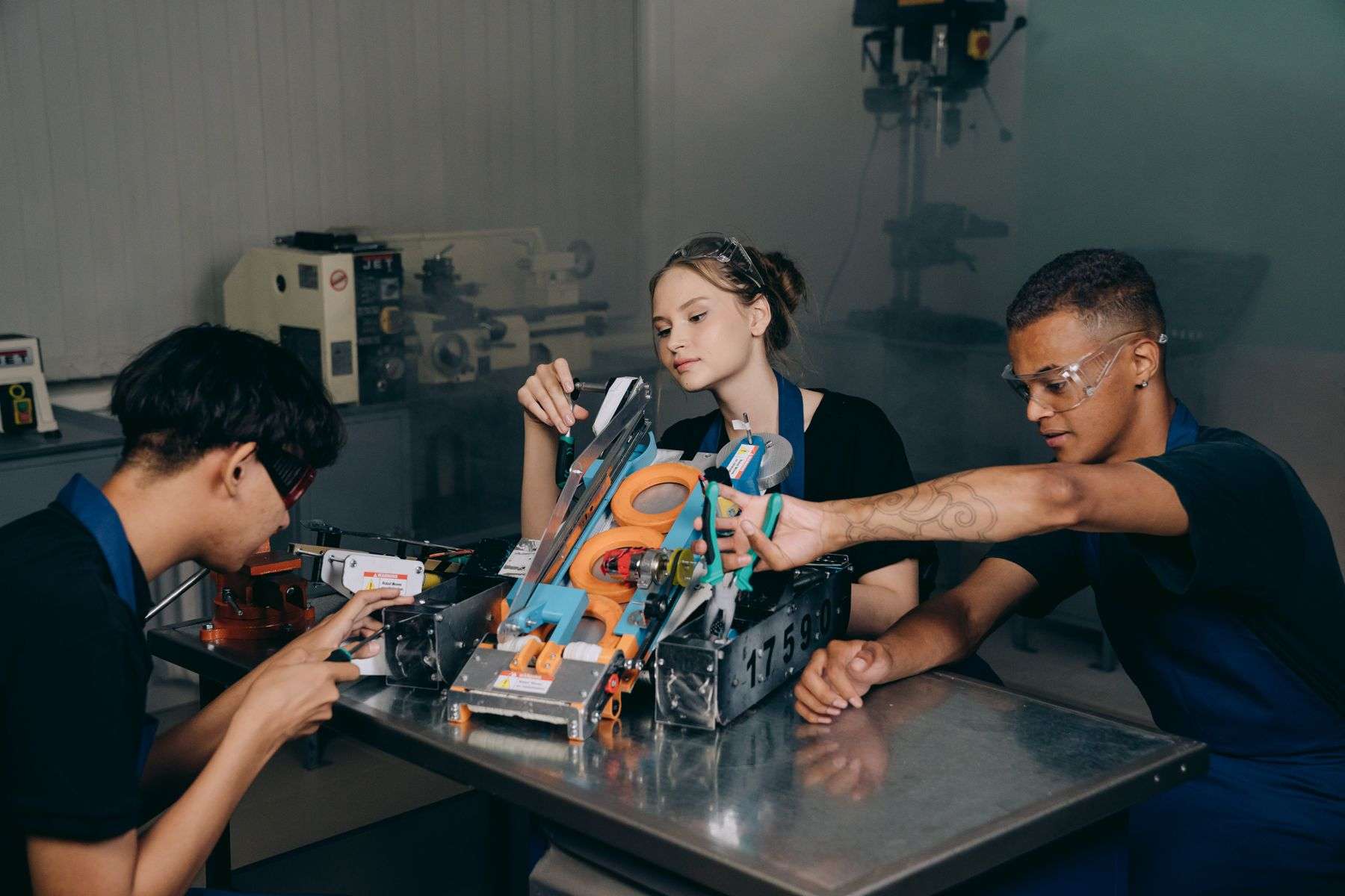 Students building and testing a robotics team entry