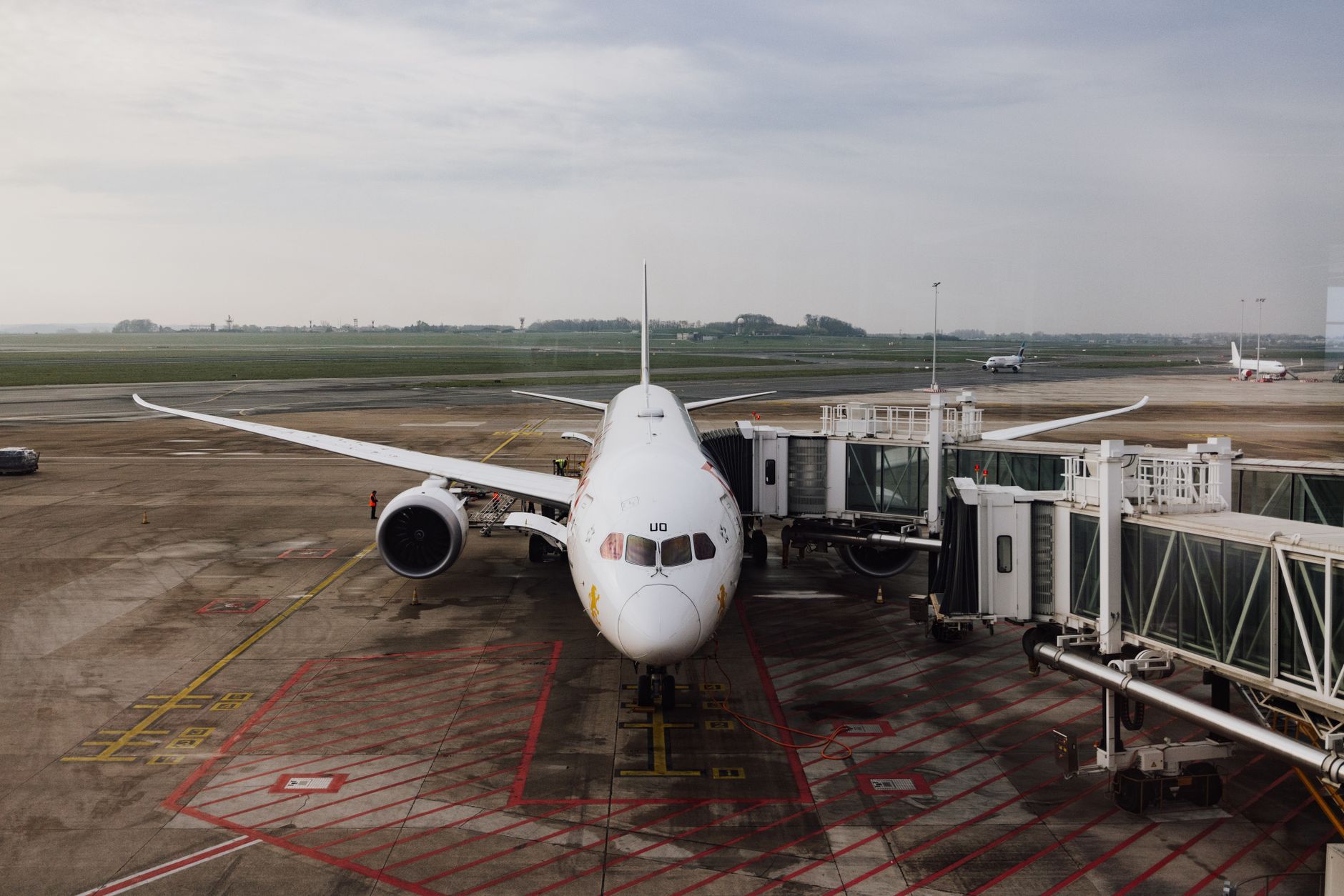Commercial jet parked at a regional airport terminal gate