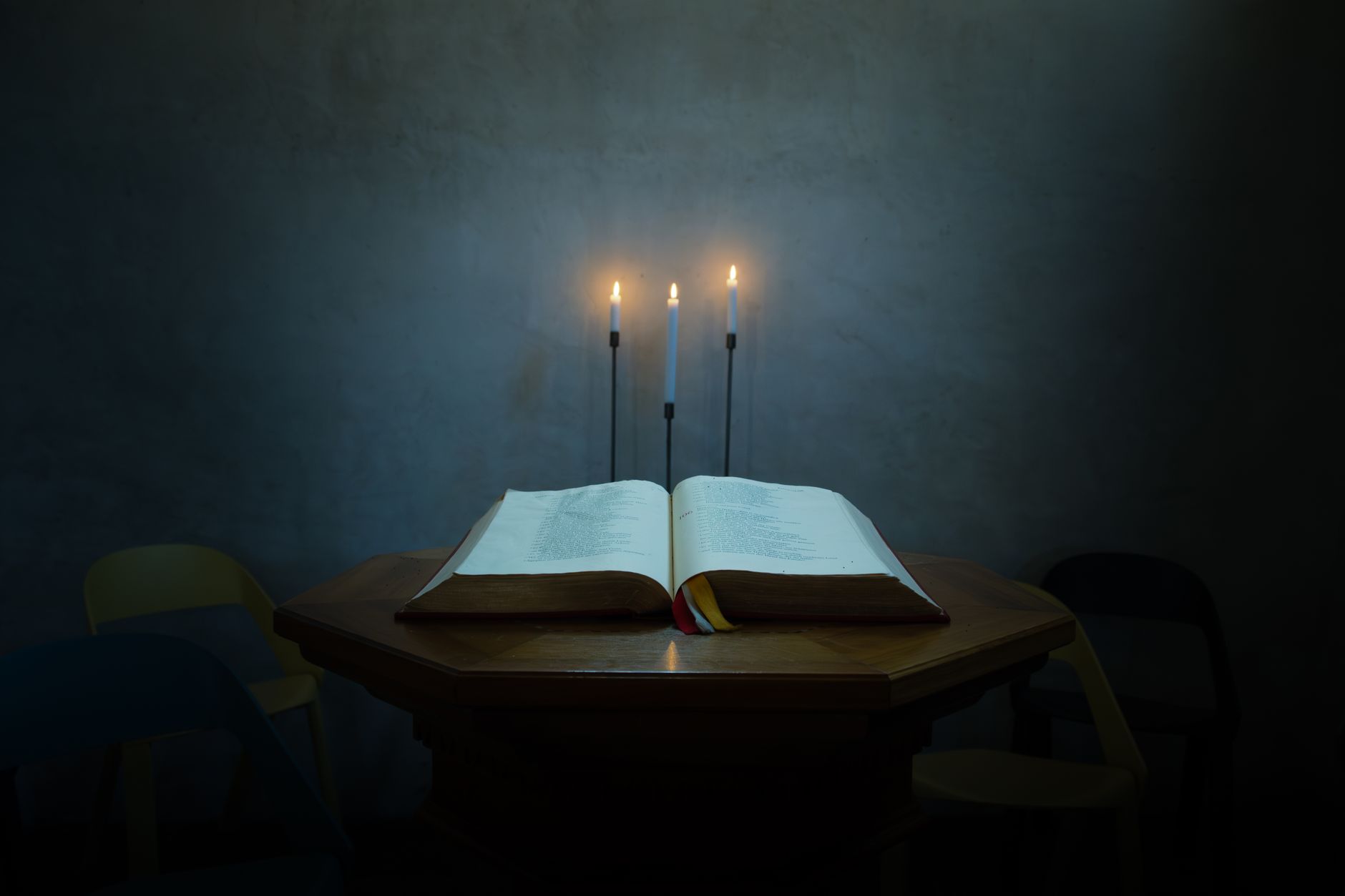 An open book beside soft light