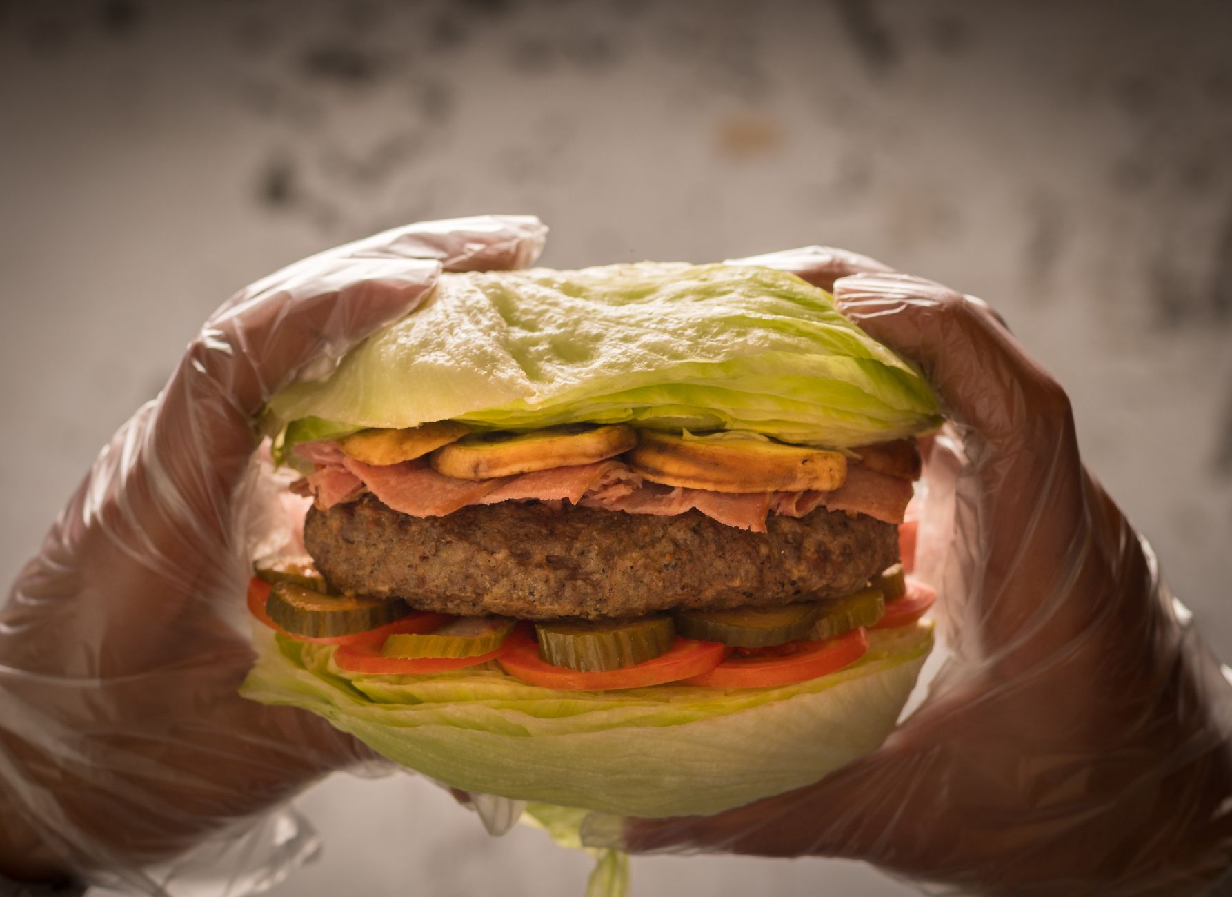 A turkey burger on a bun with fresh toppings