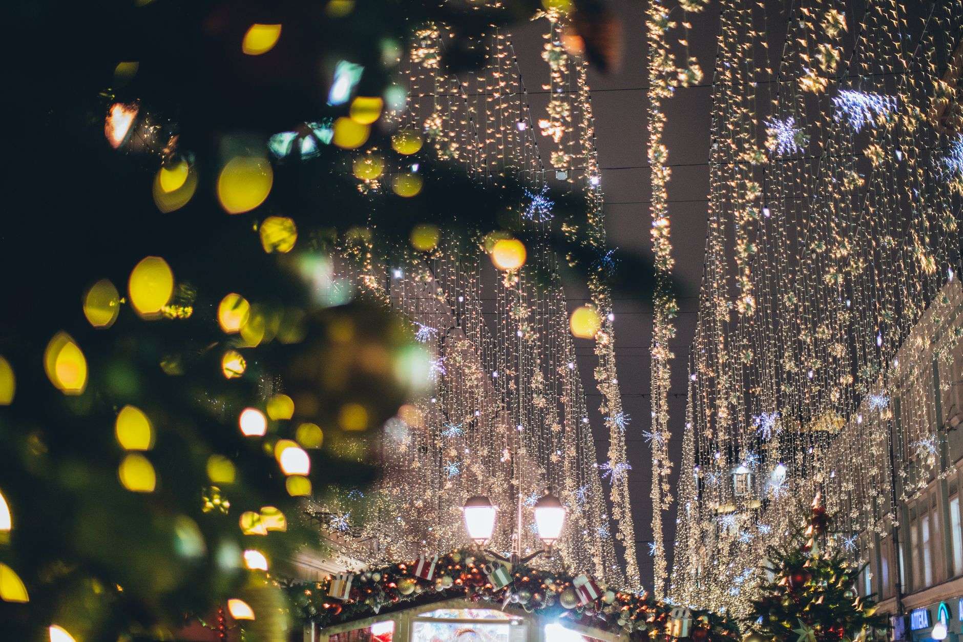 Holiday lights and Christmas decorations along a city street