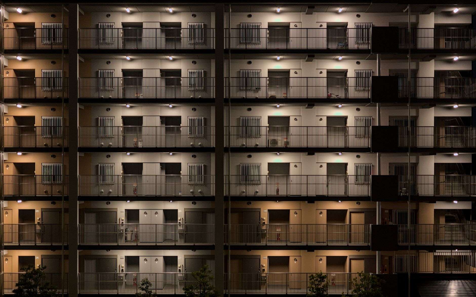 Exterior view of a residential apartment complex in the evening