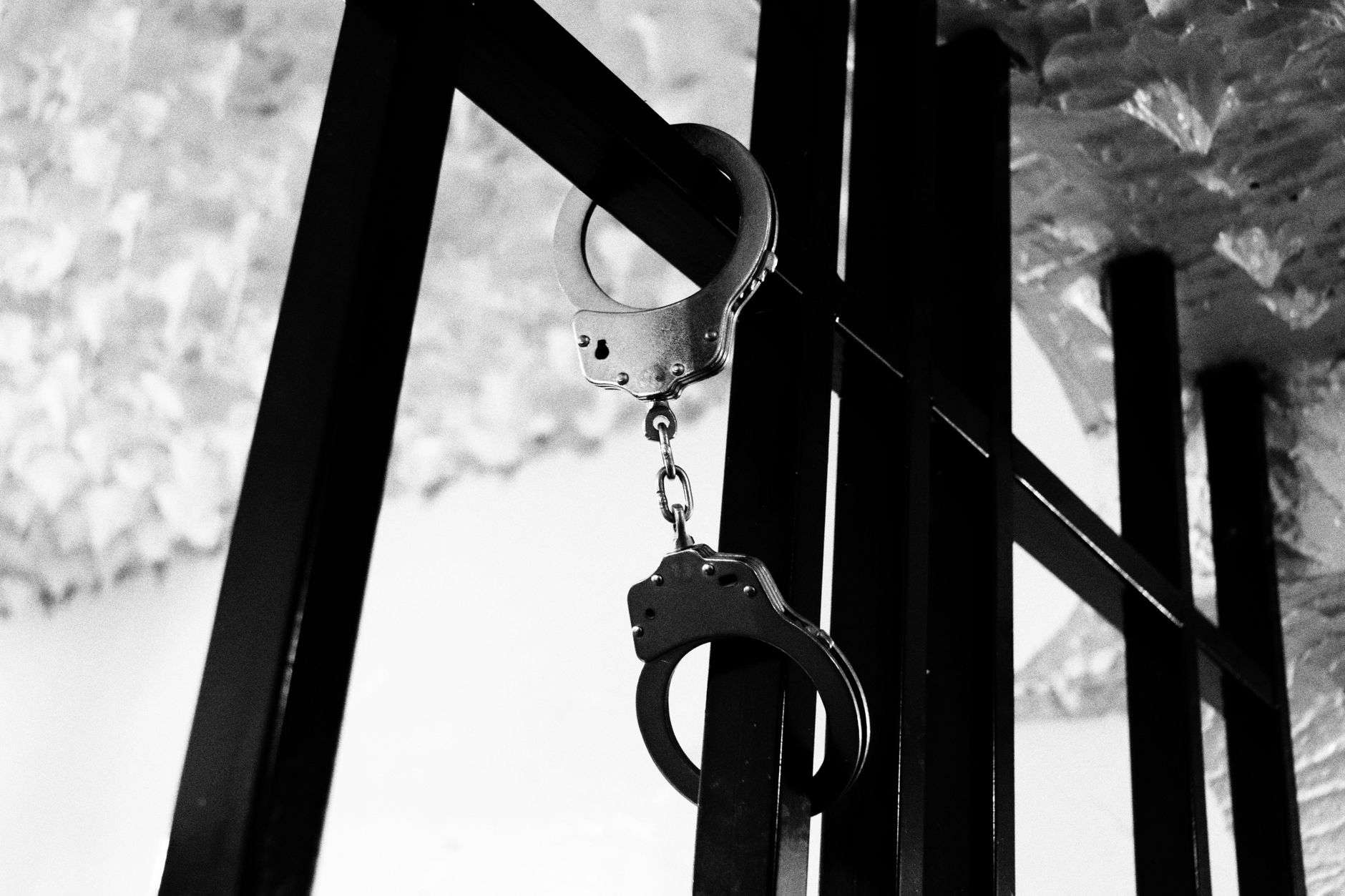 Gavel and handcuffs symbolizing a fraud arrest and criminal court case