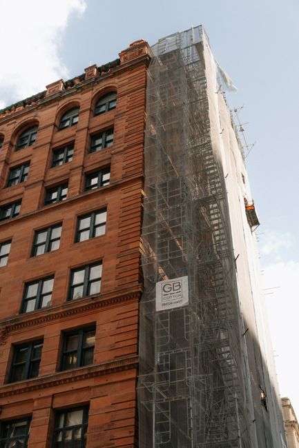 A historic brick building in a downtown district being considered for renovation