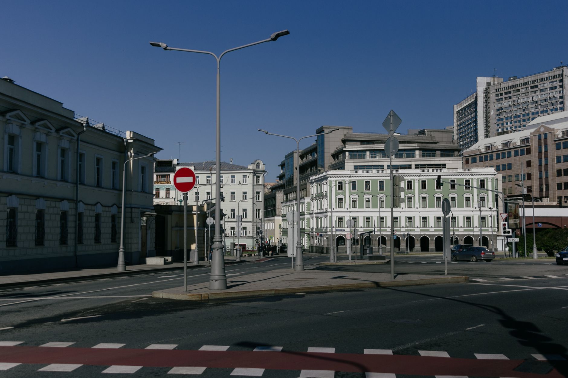 A historic downtown street with traffic signals and storefronts