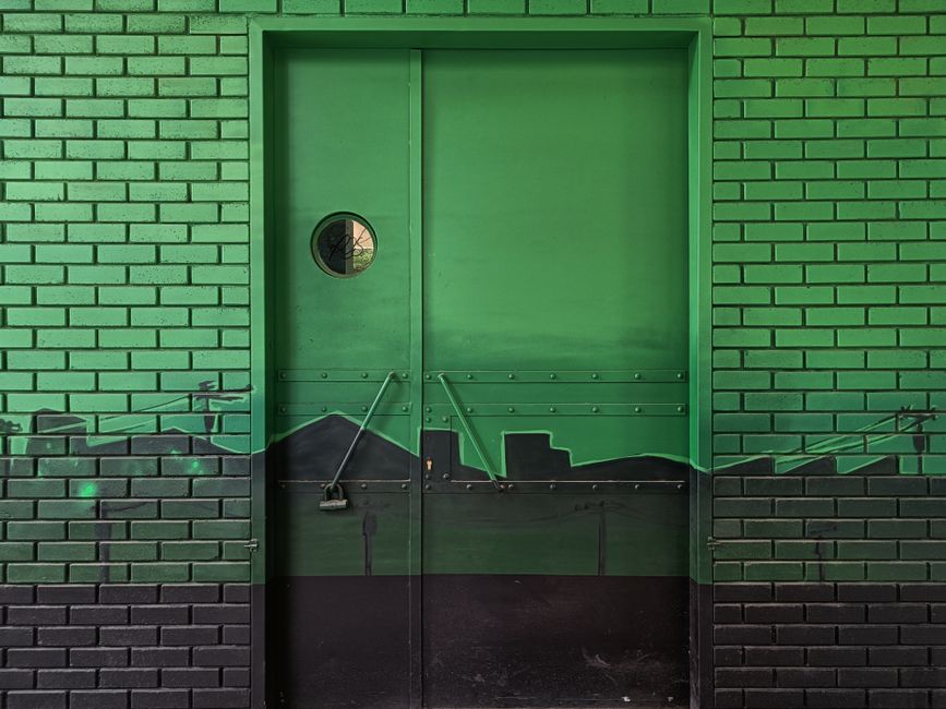 A brightly painted door mural similar to the Mobile-themed artwork created by Dunbar Magnet students