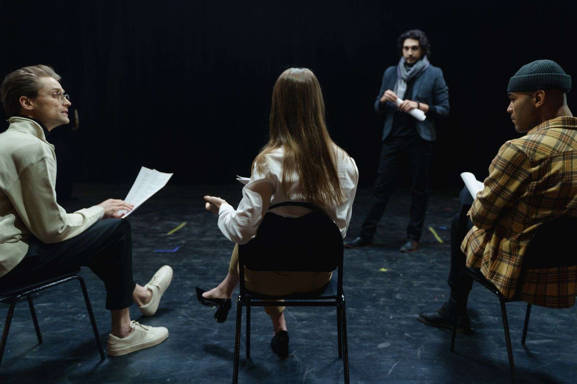 Actors rehearsing on stage during community theatre auditions