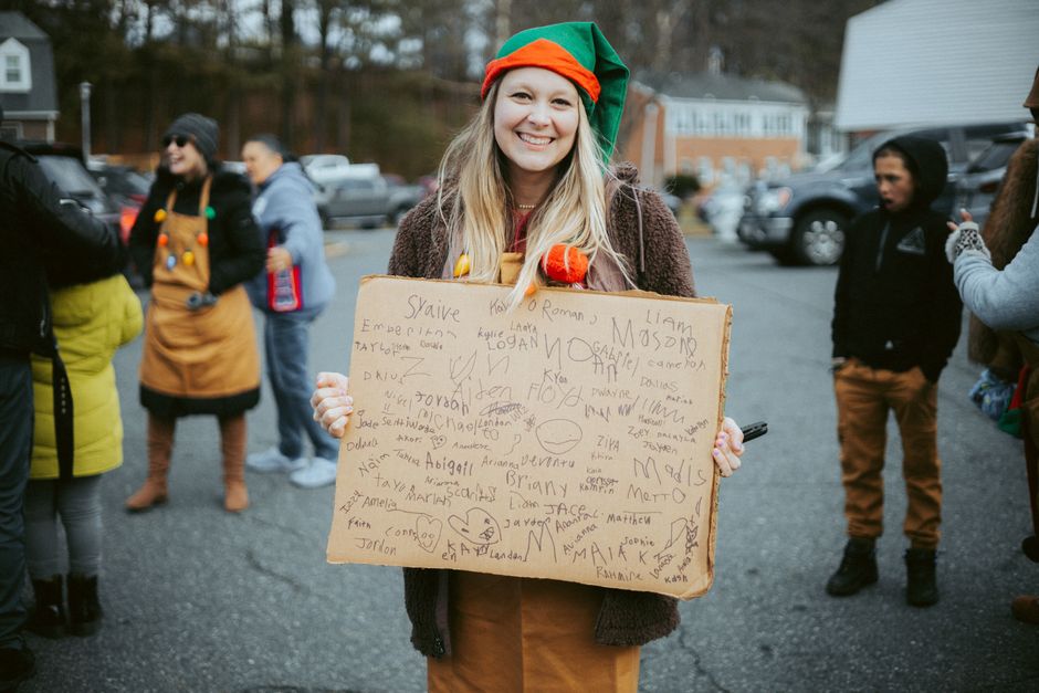 People in elf costumes gathered for a holiday event in downtown Mobile