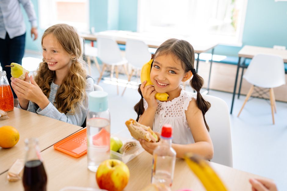 Students in a school cafeteria during lunch