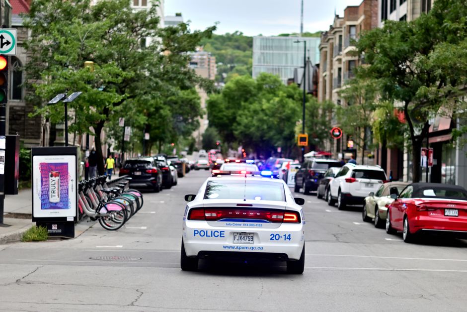 Police vehicle on a city street during a search operation