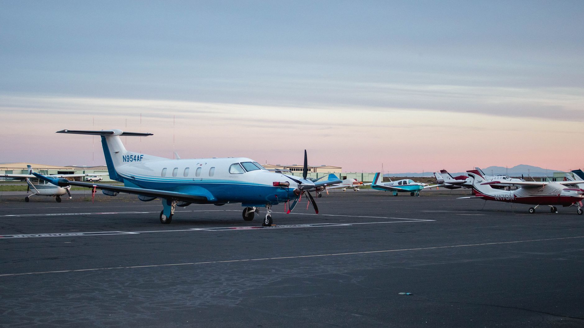 A light aircraft on the runway of a small regional airport