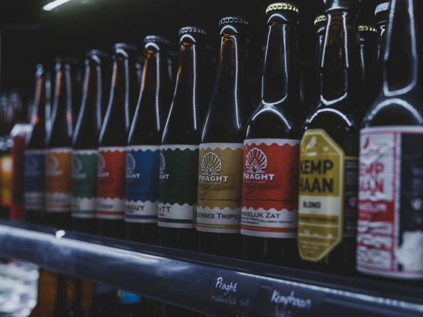Bottles of craft beer lined up at a brewery