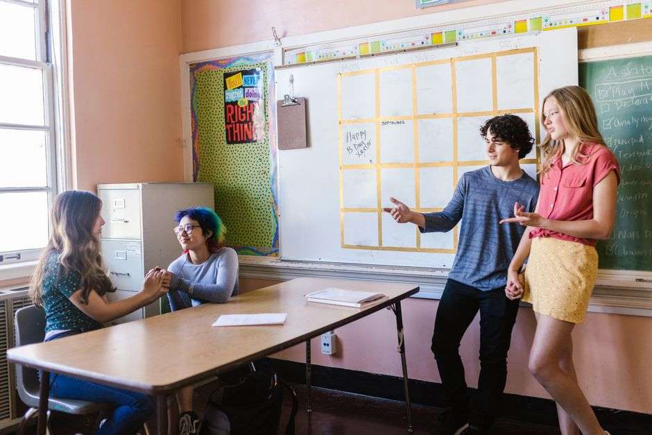Students engaged in a high school classroom discussion