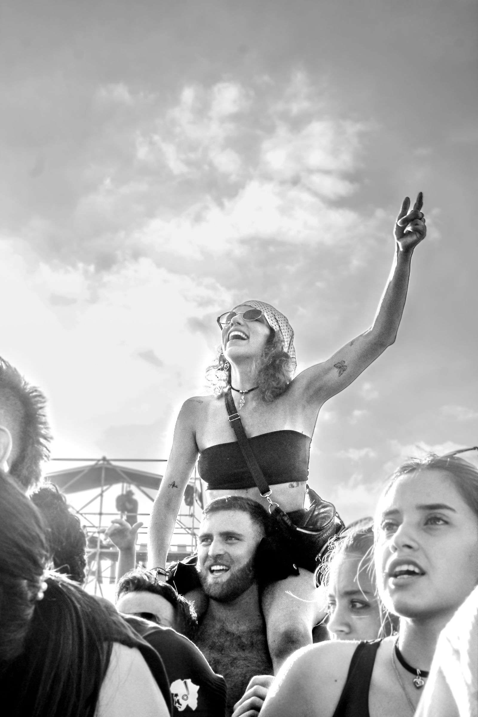 Crowd of people gathered outdoors at a music festival