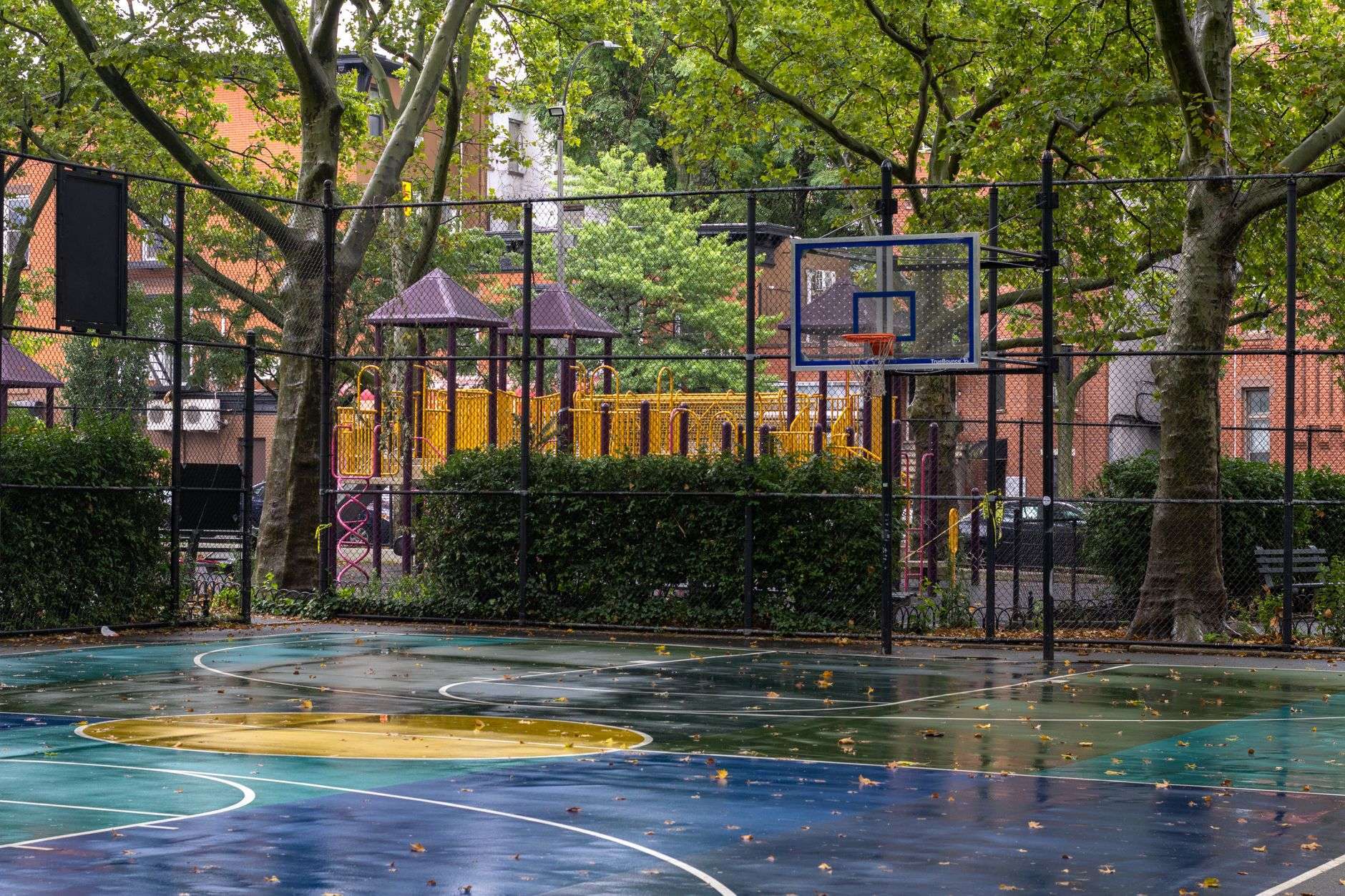 Community basketball court similar to the setting for Figures Park Community Day in Mobile