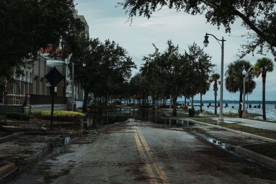 Flooded street with standing water during tropical storm conditions in South Alabama