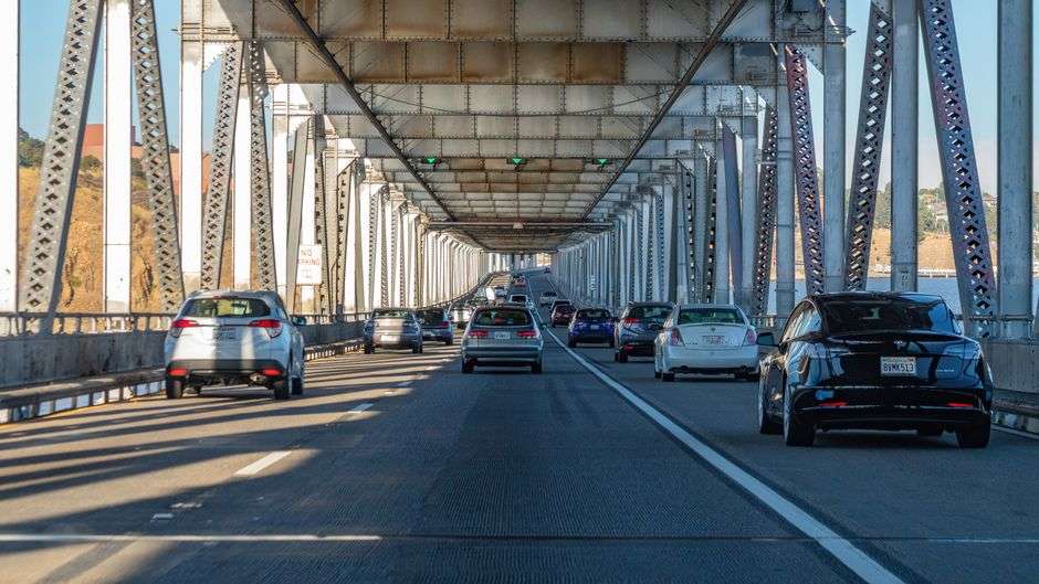 Traffic crosses a toll bridge over water in coastal Alabama