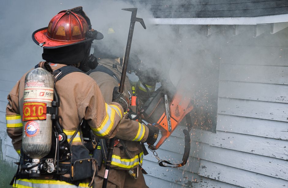 Firefighters responding to a house fire